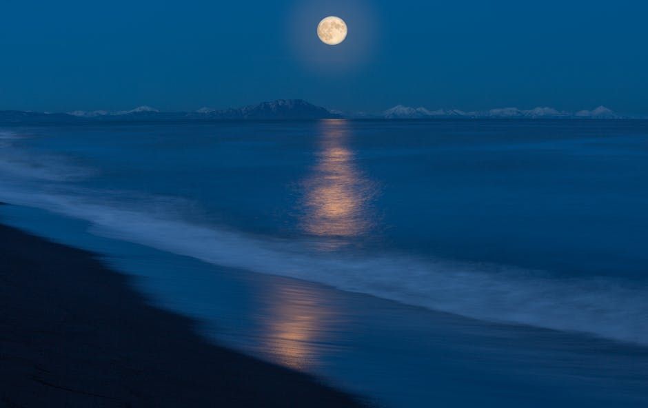 a large shining moon against the background of 3 planets and shooting stars on the horizon with a black sky