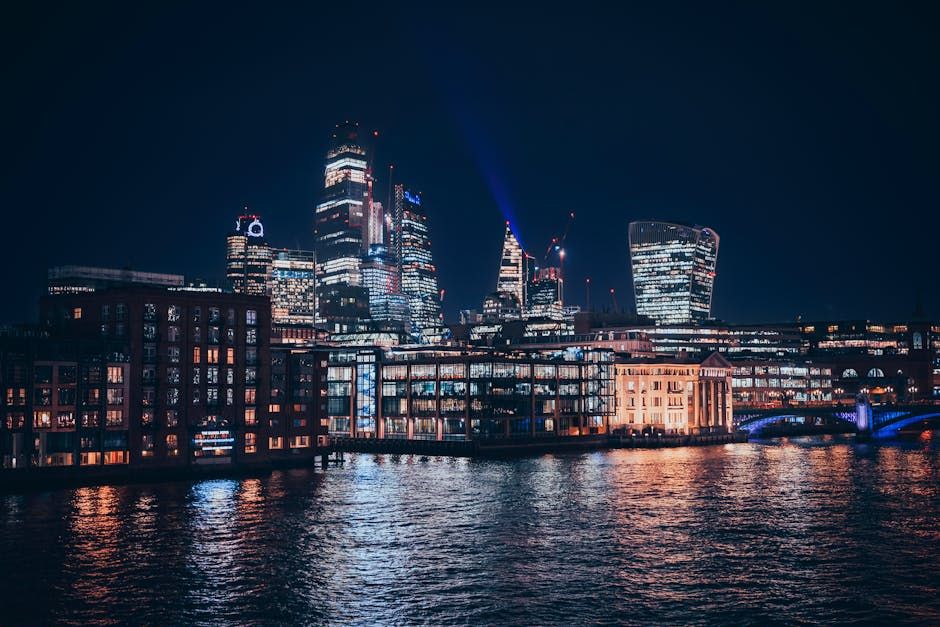 A stunning minimalistic close-up captivating vibrant woman with flowing gold hair that seems to merge with abstract swirling patterns. They...