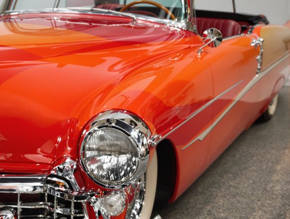 Generate a sharp, detailed photograph of a vintage car restored to pristine condition using AI enhancement. Or, create a modern bubble diagram generator output showcasing project dependencies with interconnected, glowing orbs.