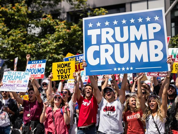 A vibrant and persuasive political sign featuring bold typography and patriotic colors. The design should evoke a sense of community and positive change. Depict a diverse group of supporters in the background, cheering and holding similar signs.