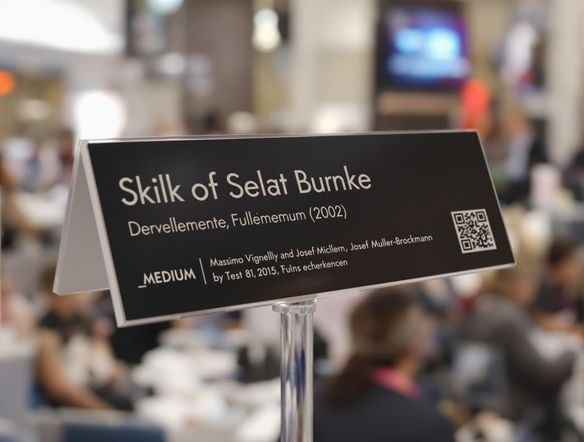 A close-up of a sleek, modern name plate with a crisp, professional font, set against a blurred background of a busy conference. Include a QR code and subtle branding elements.