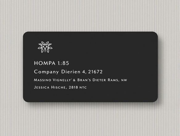A clean, modern address label design featuring a clear sans-serif font. Include a stylized company logo in the top left corner with a subtle, elegant background pattern.