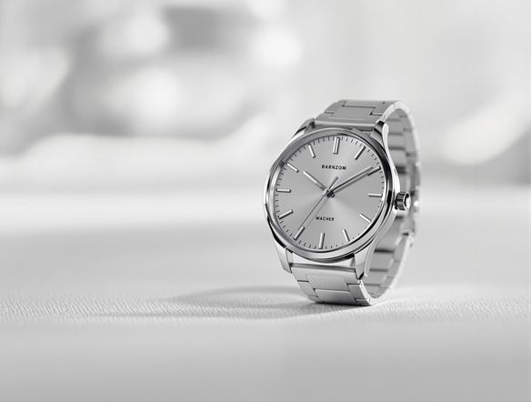 A high-quality photograph of a sleek, modern product (e.g., a watch or phone) set against a blurred, minimalist background with soft lighting. The background should be neutral and non-distracting, emphasizing the product.