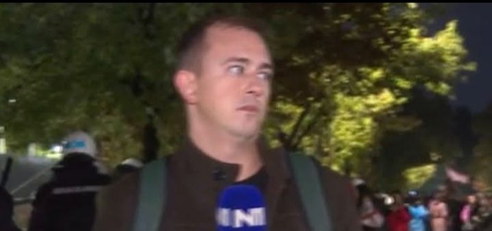 Convert the uploaded image into a South Park-style parody character. Keep the background and general composition mostly the same. The charac...