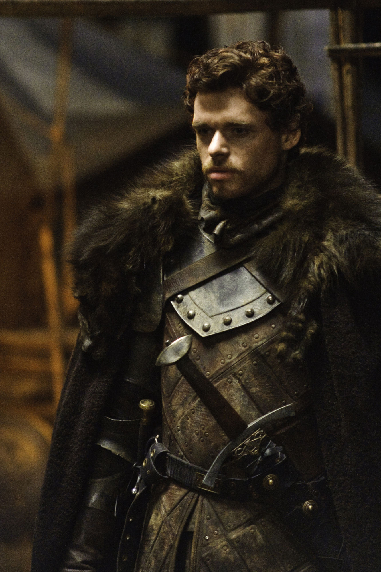 Jon Snow as a werewolf, wearing black colored boiled leather armor with black steel plate armor on his upper chest and wrists. Standing in a...