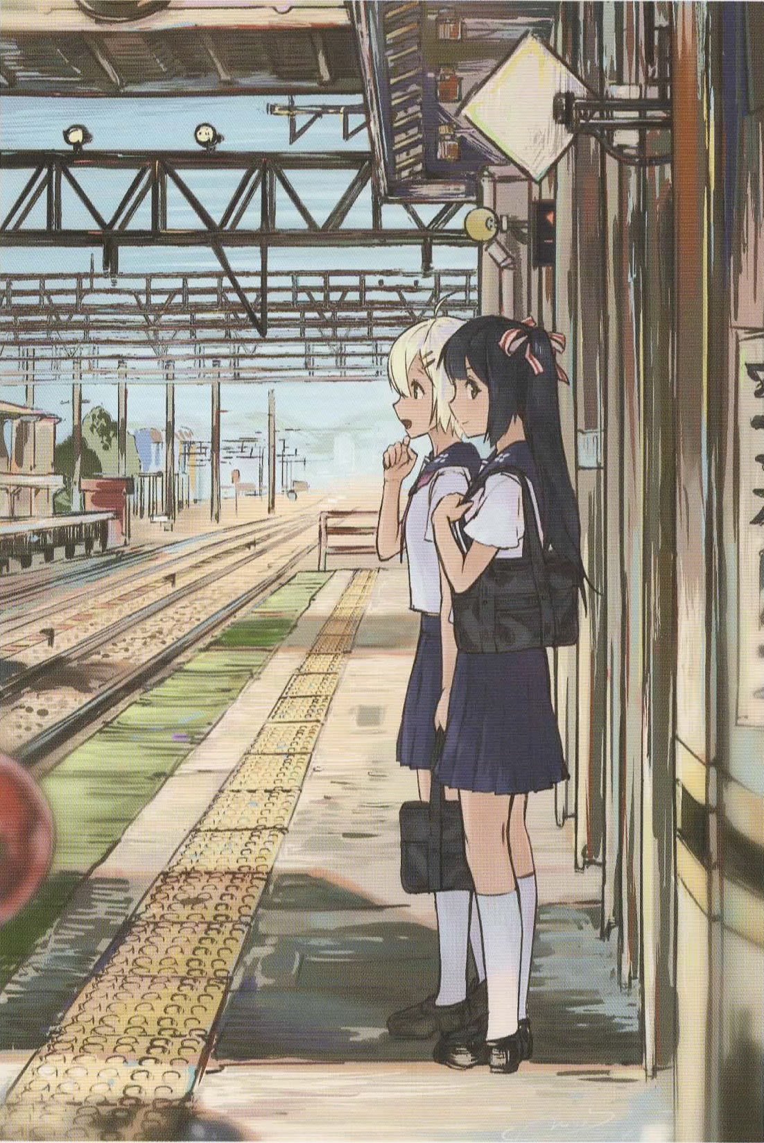 Two girls are waiting at peron train station 