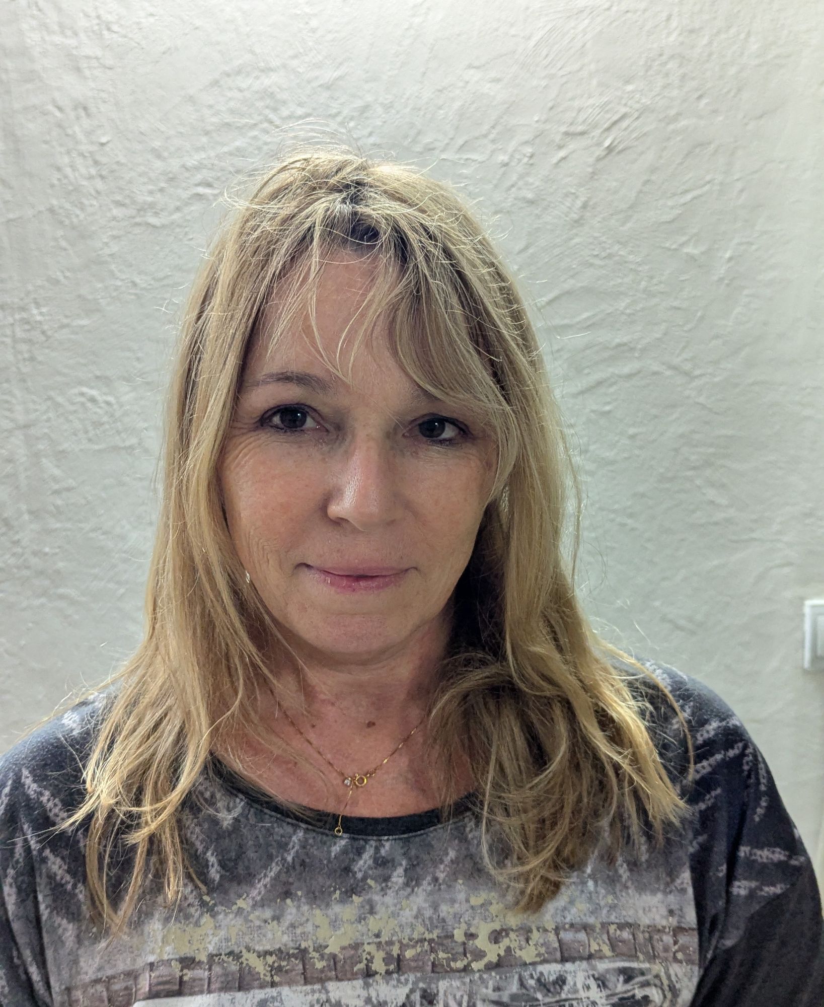 A digital illustration of a confident middle-aged woman with natural expression and elegant posture, realistic compared to the photo