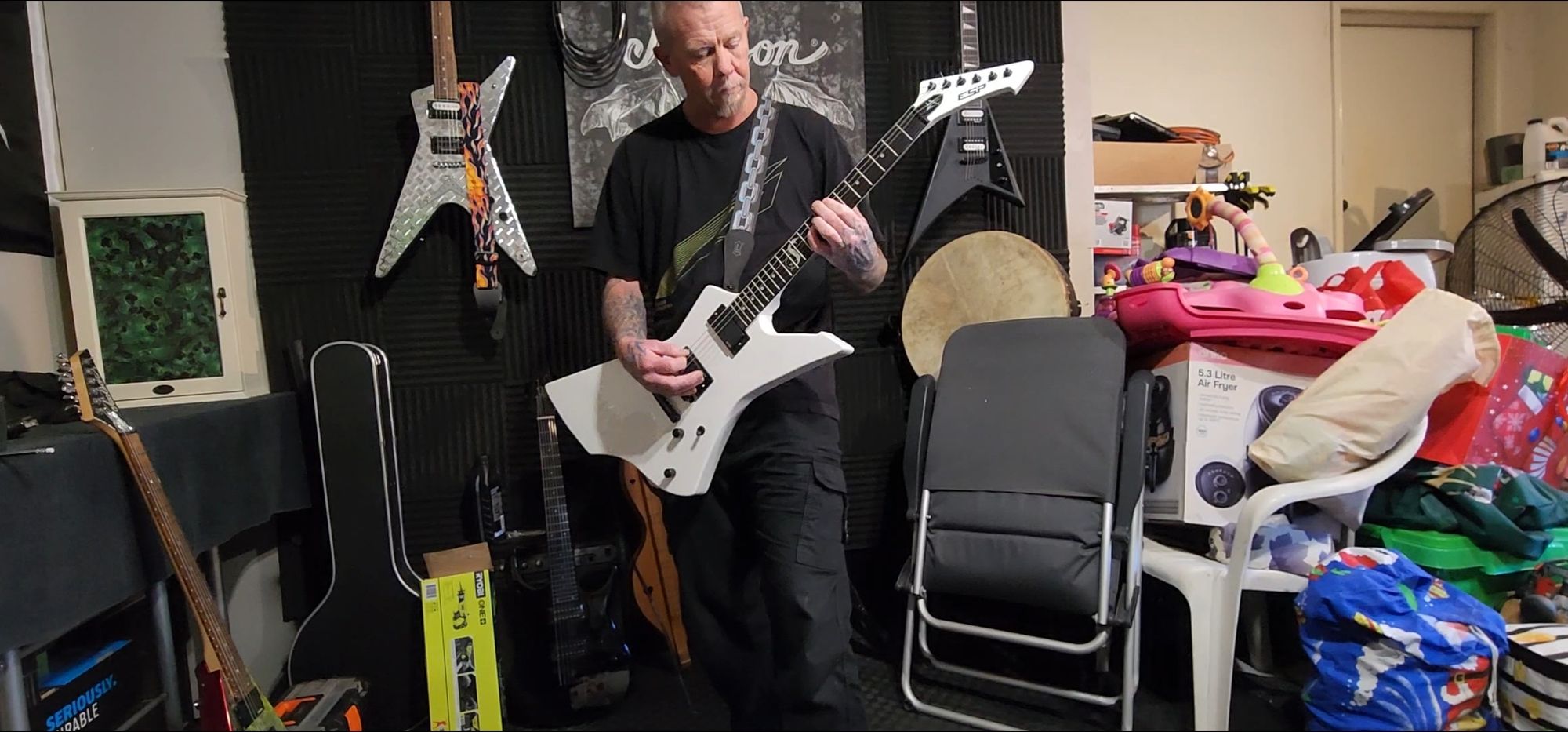 Playing guitar on stage in a heavy metal band