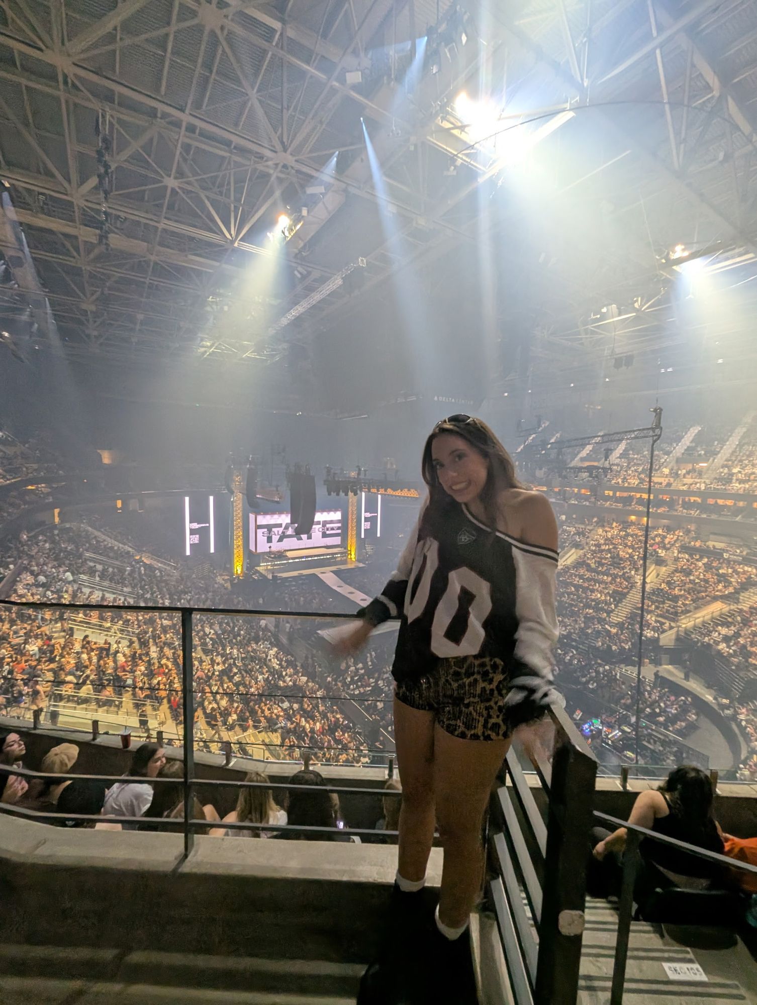 A vintage Hollywood starlet, draped in elegant 1940s attire, stands on a balcony overlooking a vast, star-filled galaxy. The scene evokes cl...