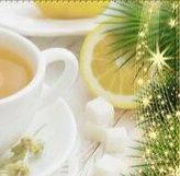 cup of green tea with lemon, christmas tree, sugar cubes on white table