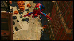 Hooded spider man in black and red doing a gainer off the side of building in a crowded city at night