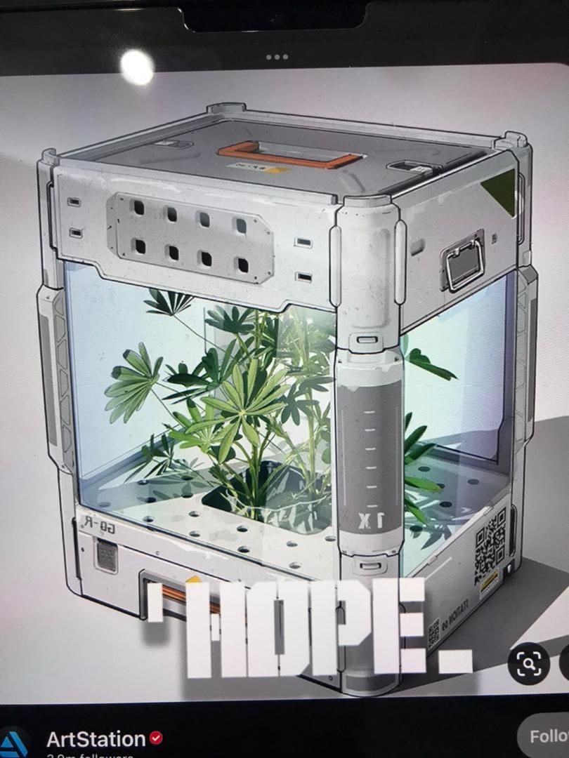 Clear crystal cube, no lines, conceals 16th century gold necklace with 12 carat red diamond pendant necklace on a metallic electronic device...