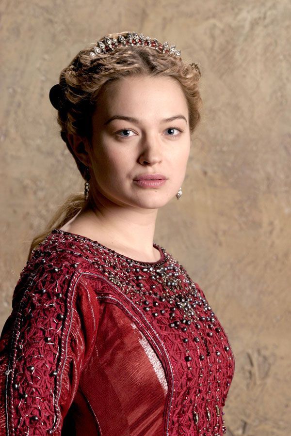 The series house of the dragon. A luxurious medieval room where everything looks exquisite. There is a young queen in it. She has long white...