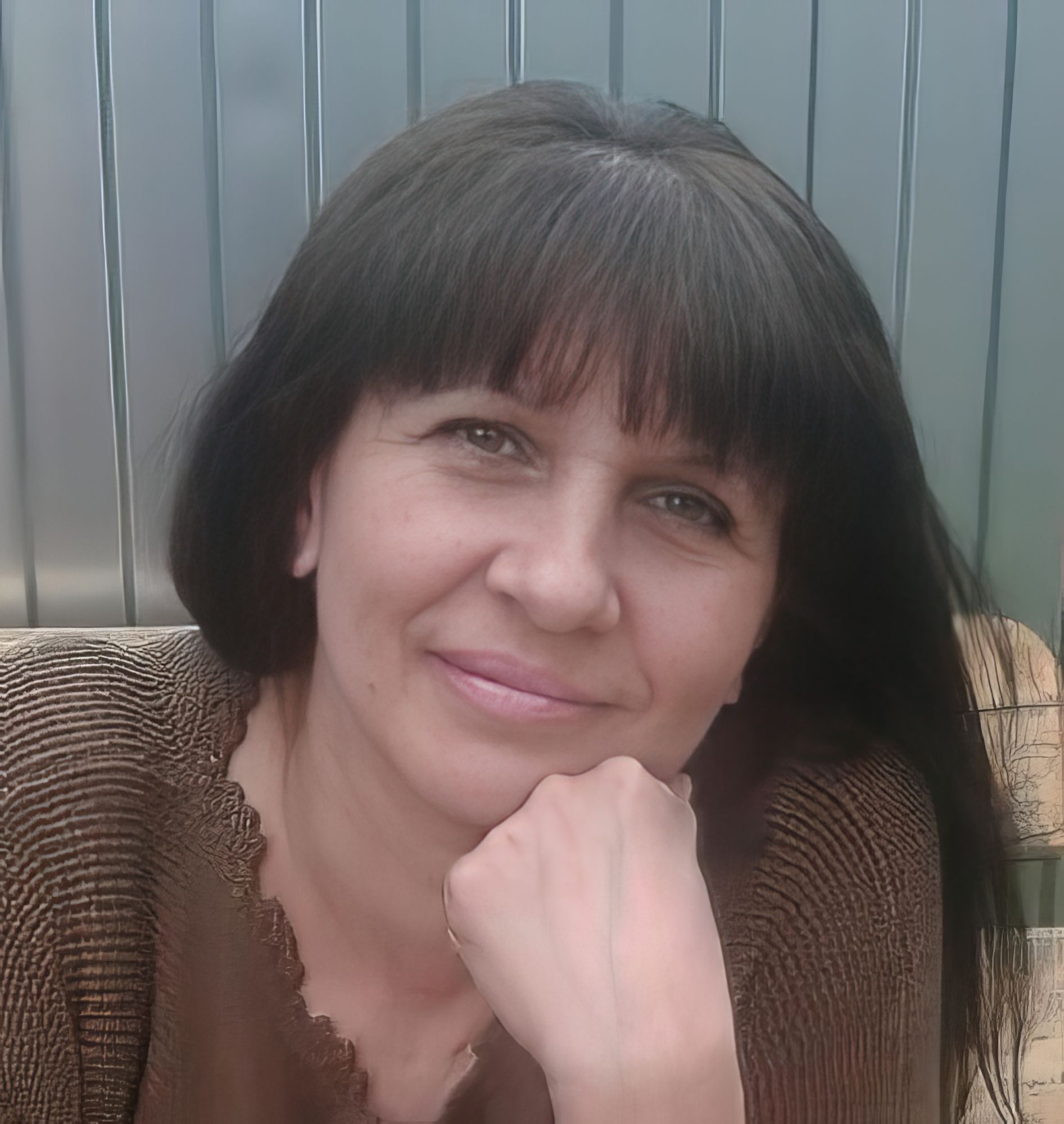 The image is a sketch of a woman's face. The woman has long hair, a jewel on her forehead, and long dangling earrings. The sketch is done in...