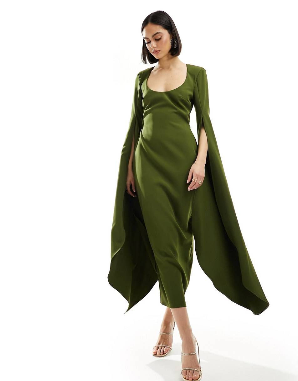 fat nice woman in a green silk dress with angel sleeves, 