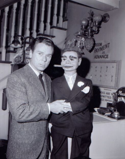 Evil man with an evil ventriloquist dummy H.R. Giger surrealism