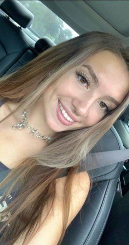 Lady sitting on a bed