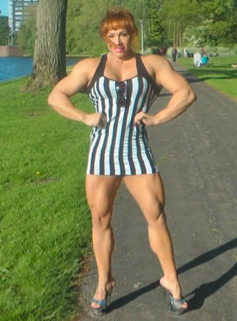 Amazingly beautiful Muscle Goddess in a park in Amsterdam