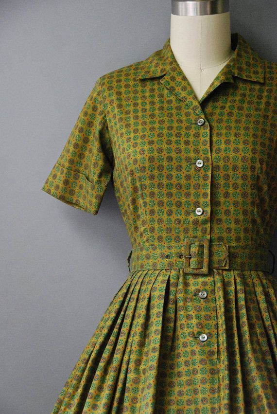 Create a image of me wearing this dress in my 1950's style kitchen standing at my stove while cooking chicken and dumplings with the ingredi... - Start Image 1