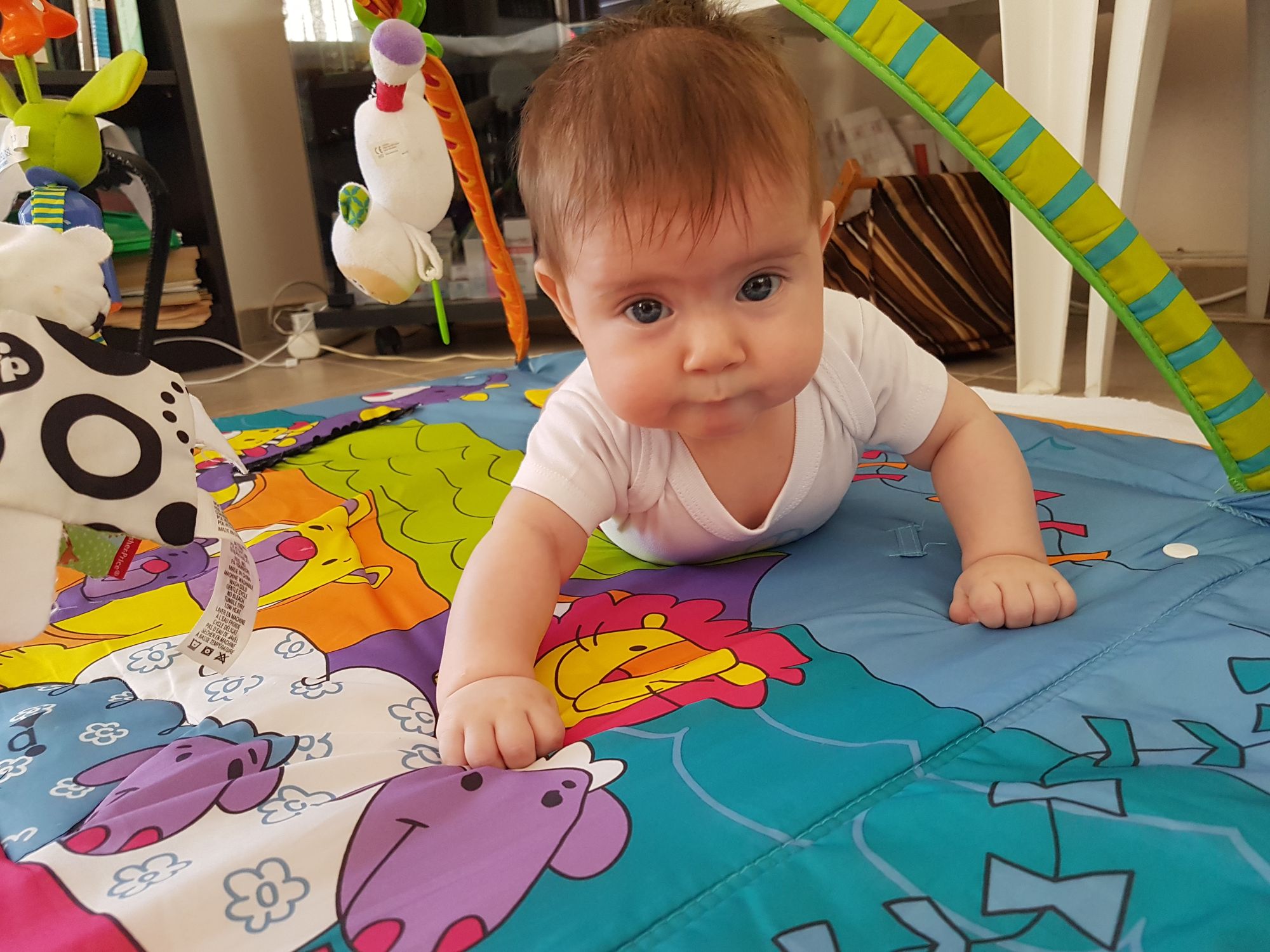 There is a cute sweet newborn baby girl with blonde hair and blue eyes flying in the sky. She's a lovely witch. The blue of her eyes and the...