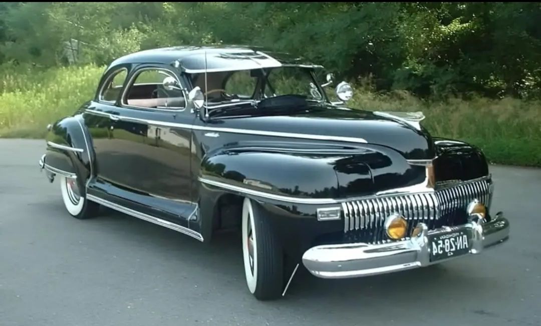 The Low Rider
Use start image to customize this1952  Desoto Deluxe, lowered to the ground, gleaming chrome accents, vibrant yellow paint job...