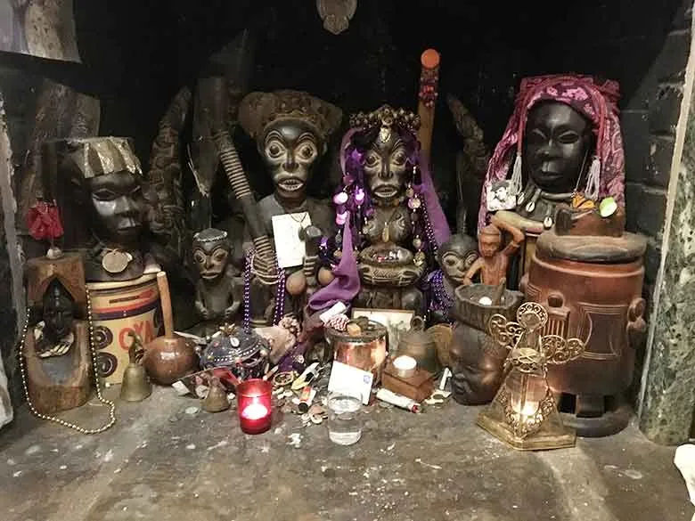 old new orleans voodoo, candles, color string lights, sage, flowers