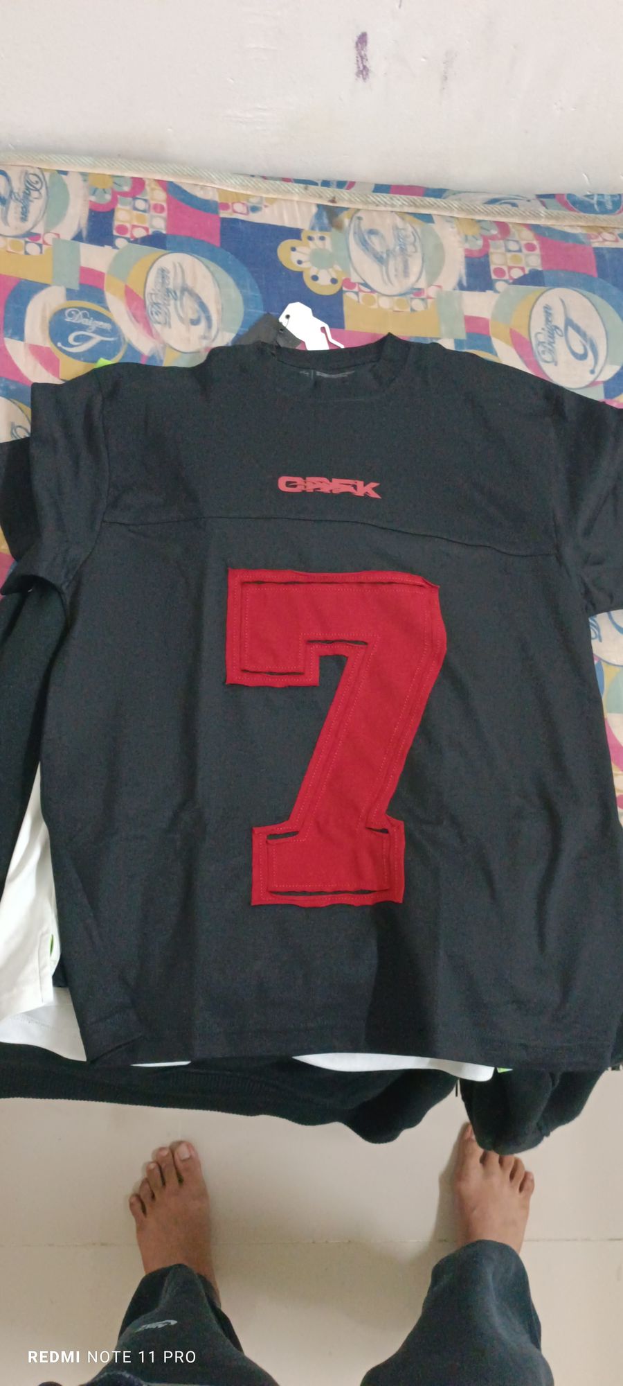 "Diss track album cover 'JUMP' with shattered Redmi Note 11 Pro, 'GREKK 57' in dripping chrome font, glitch effects, circuit-board skull, bu...