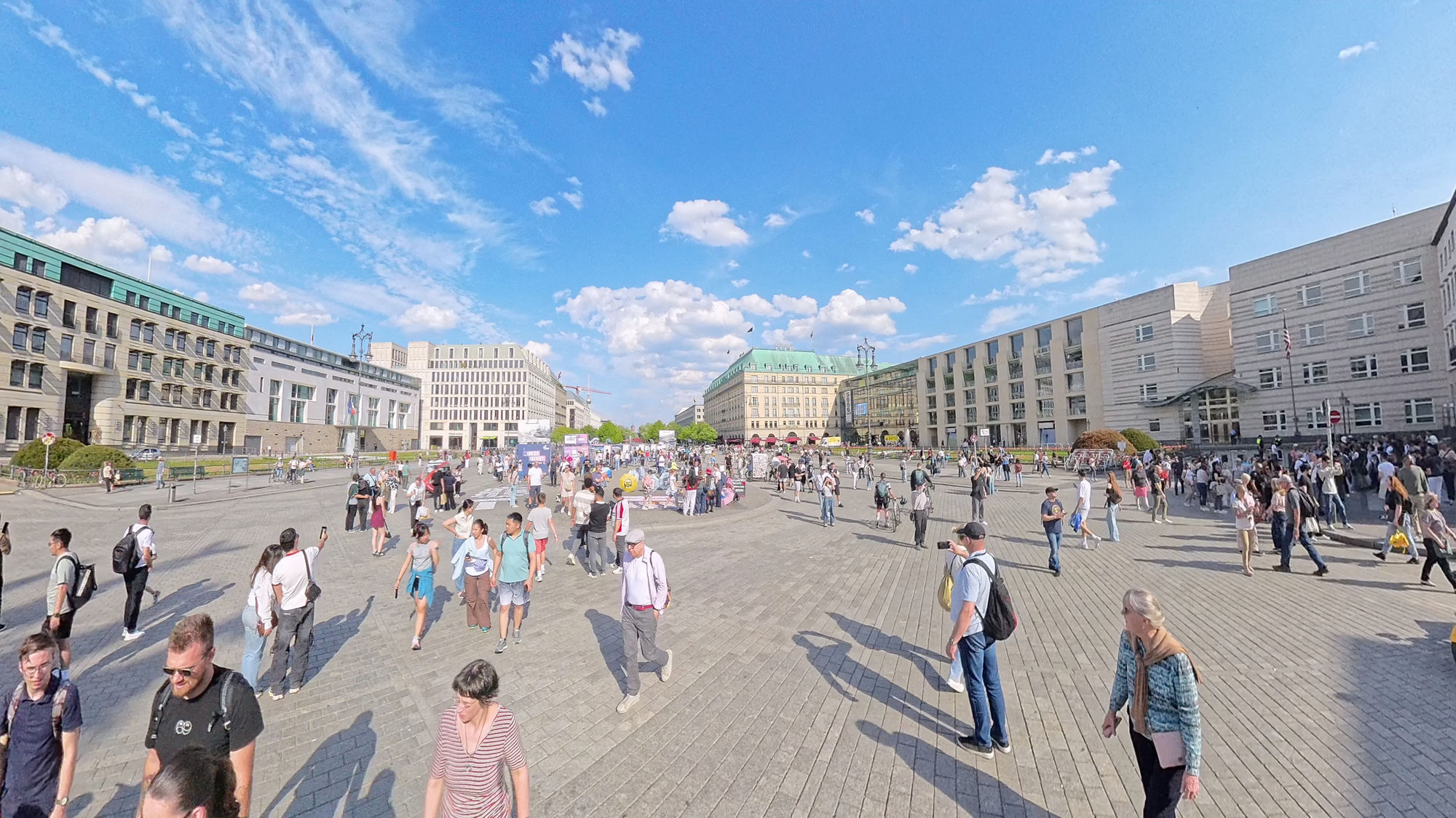 In the sky above the square place a metallic flying saucer. The flying saucer will have circular port hole around its circumference.
