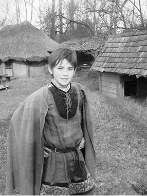 Make the boy's face rounder and add dimples. Boy should look younger and like a scamp. You'd think the AI would get it...