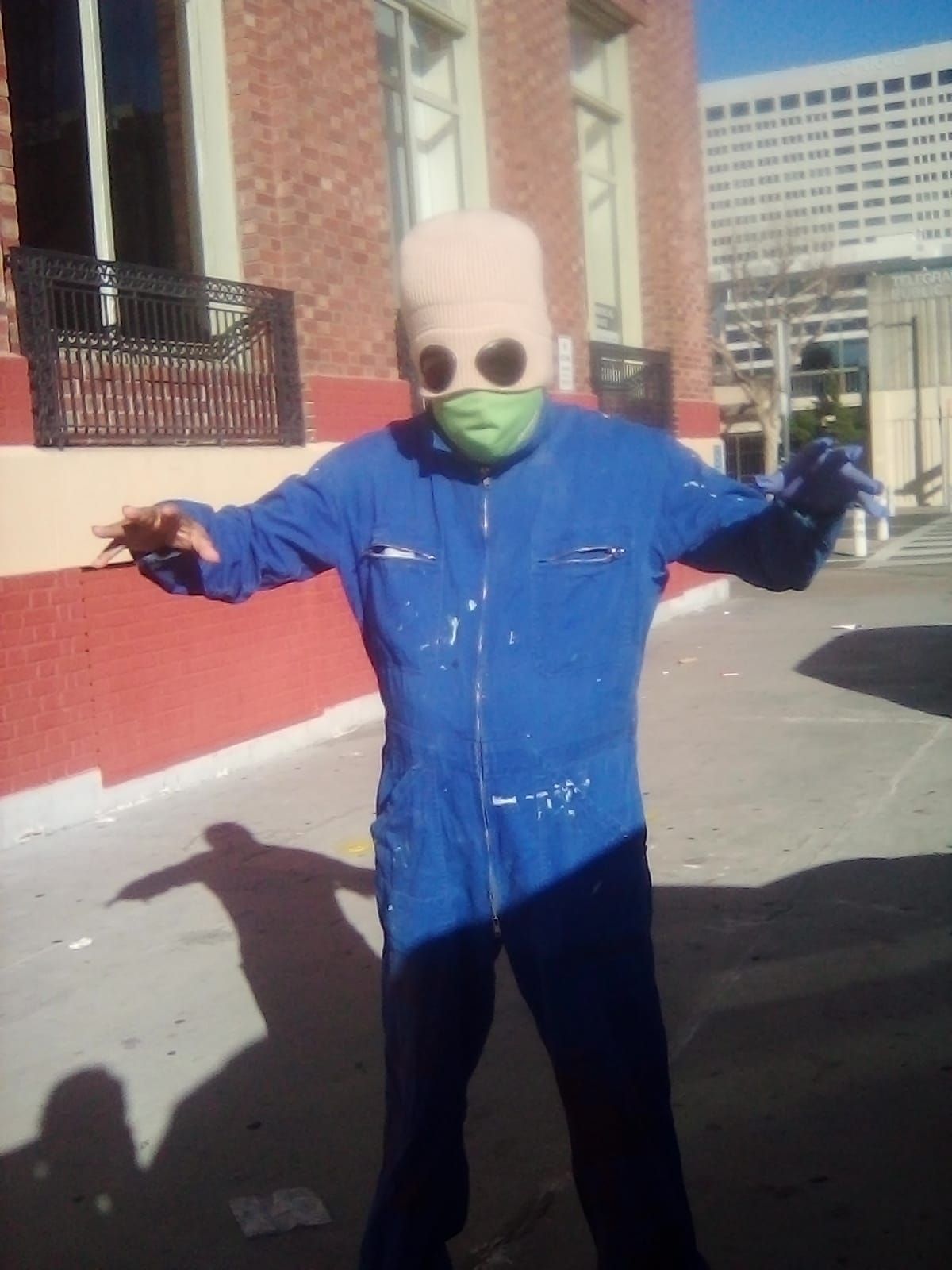 A black man wearing a bean hat with googles made into it, turns into and army of clones. tHERE ARE 10 OF THEM ALL WEARIN...