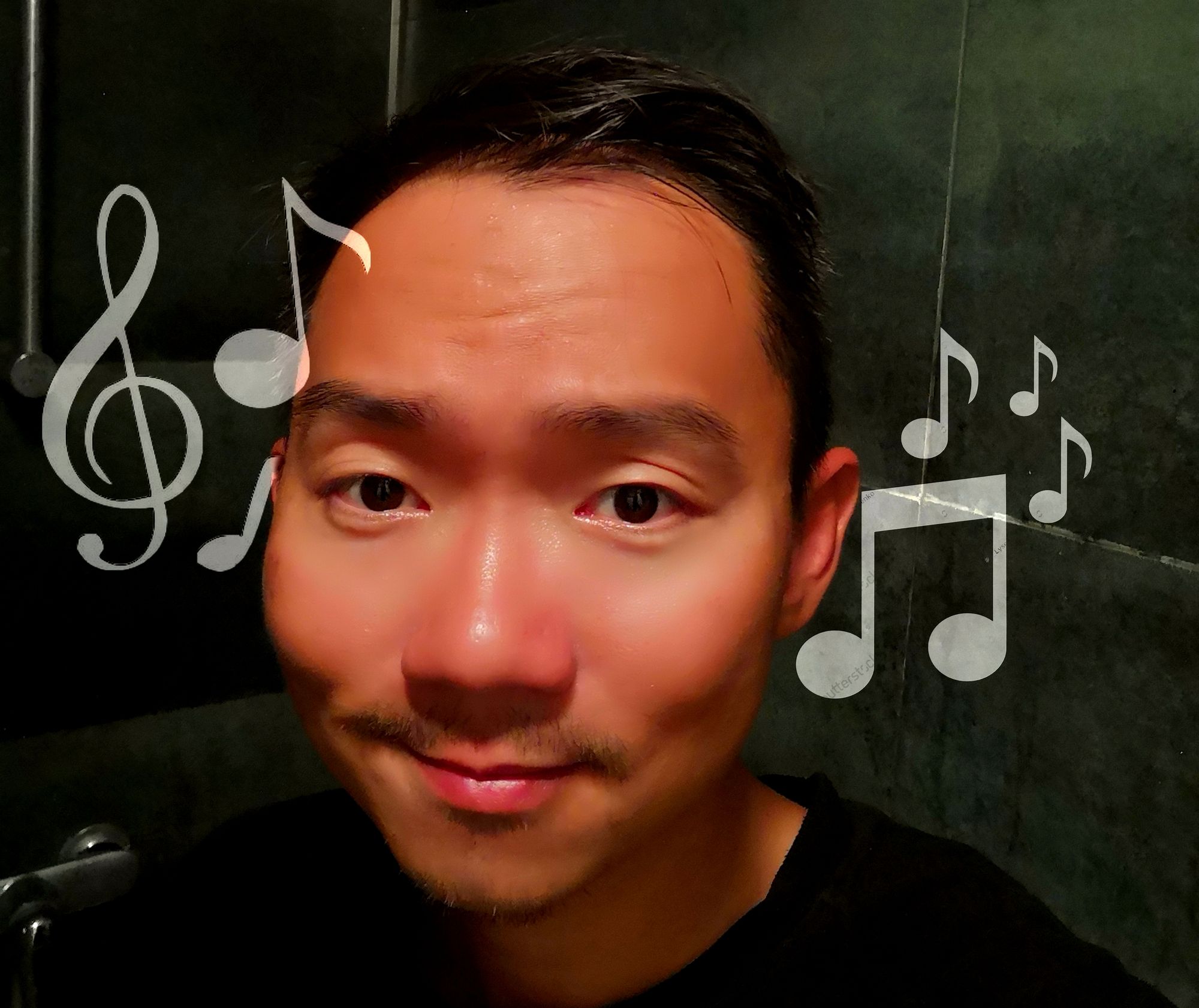 Charming musical male singer come from the dark, with a lot of melodies. His handsome face is wet with musical rain and music notes drop. Ev...