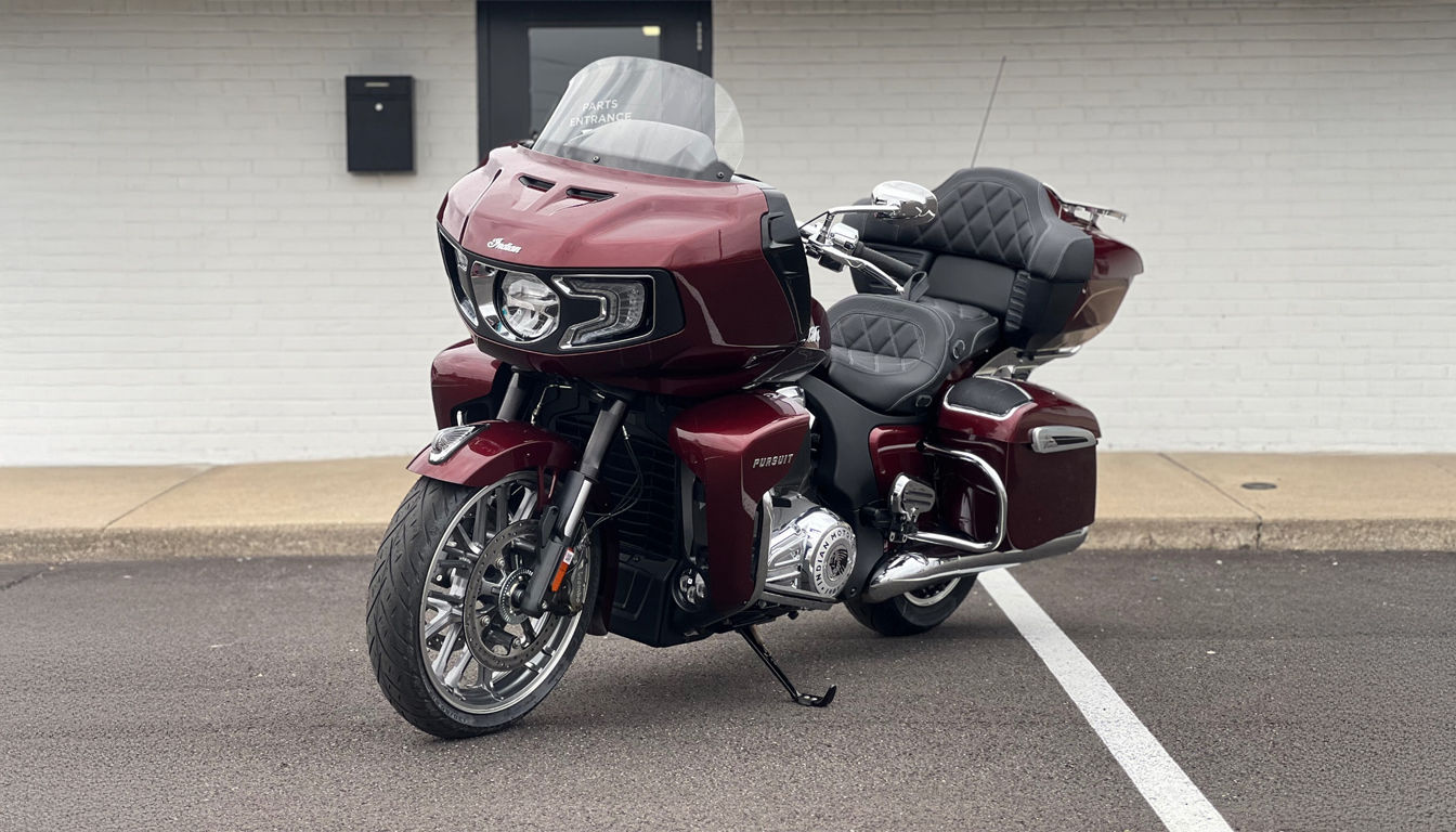 A toy scale model Indian Motorcycle on a toy garage. 