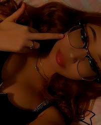 a strikingly beautiful young woman walking through an intergalactic theme park in space with nebula in the background. extremely large rolle...