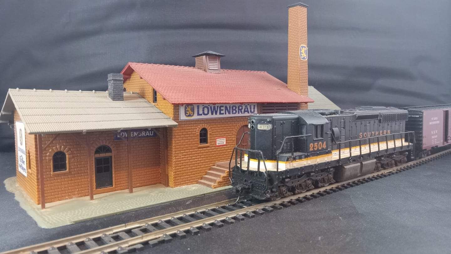 The Polar Express steaming through a snowy town, detailed snowflakes, magical auroras, highest quality photo