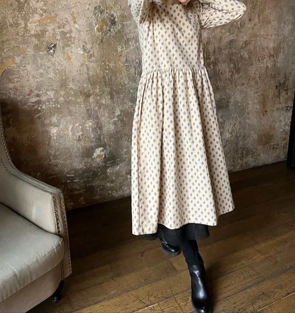 remove the dress from the model and lay it flat on the floor without folds