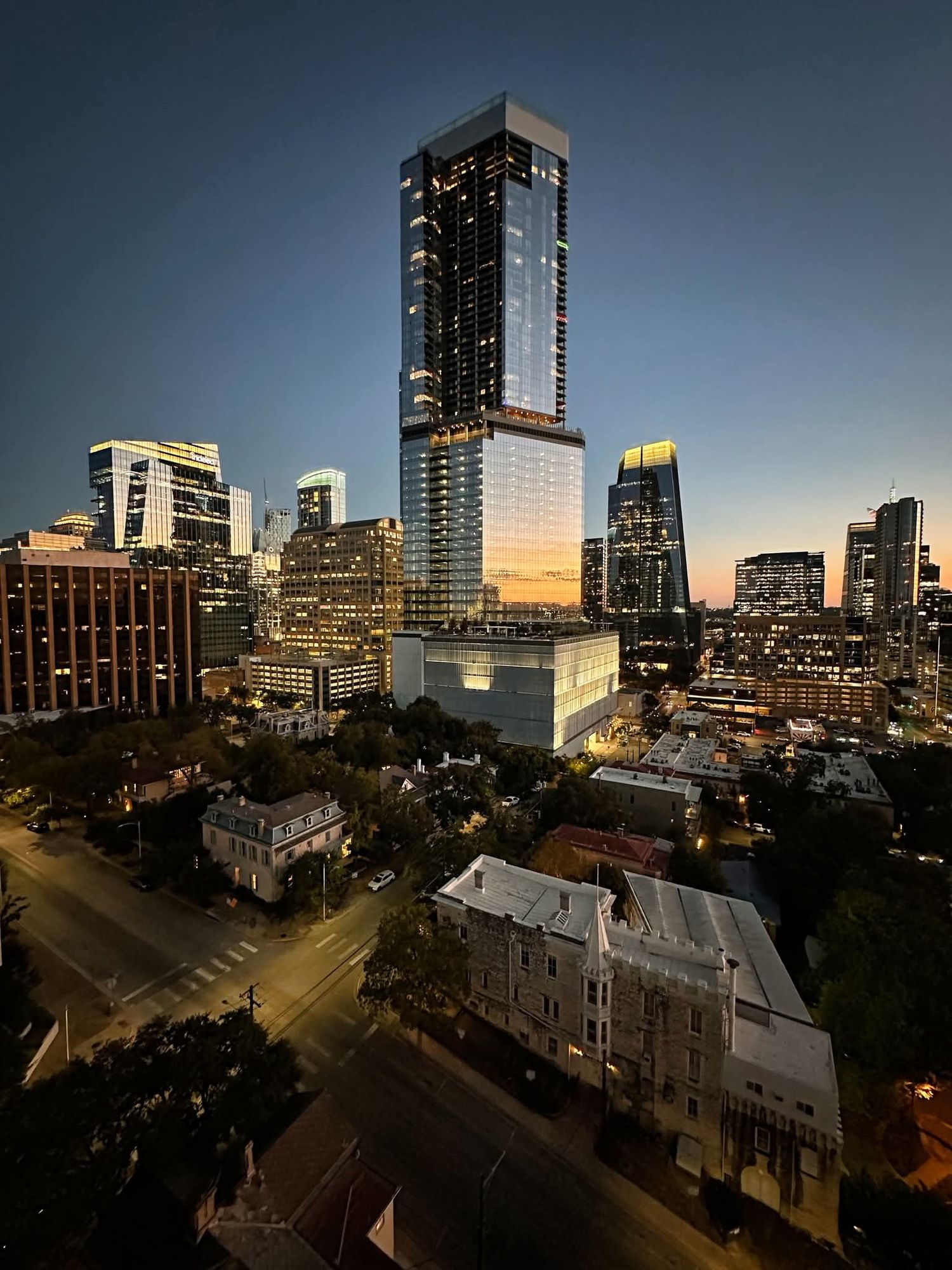  A bustling cyberpunk metropolis at night with towering skyscrapers adorned with holographic advertisements and flying vehicles with neon li...