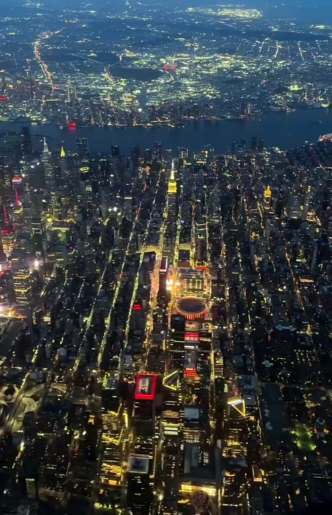 A bustling cyberpunk metropolis at night with towering skyscrapers adorned with holographic advertisements and flying vehicles with neon lig...