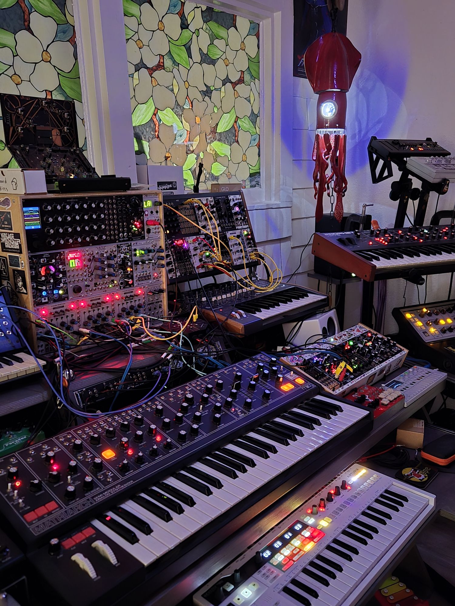 Squidlight Studio — enhance the real glowing squid lamp in the photo, making it luminous and vibrant, with ethereal neon blues, purples, and...