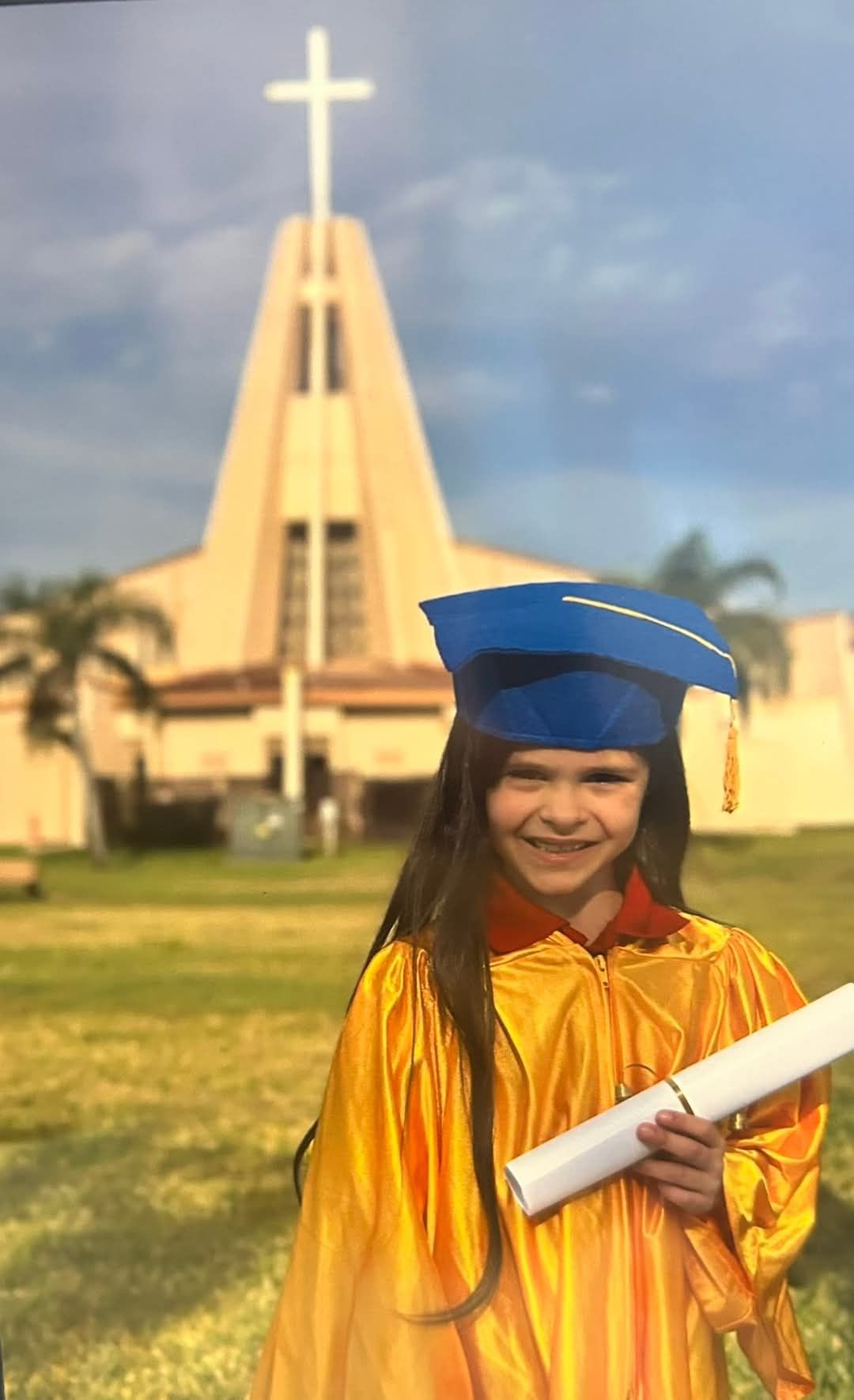 Use the reference photo and generate the same exact photo except the church building in the background of the child is on fire giant fire an...