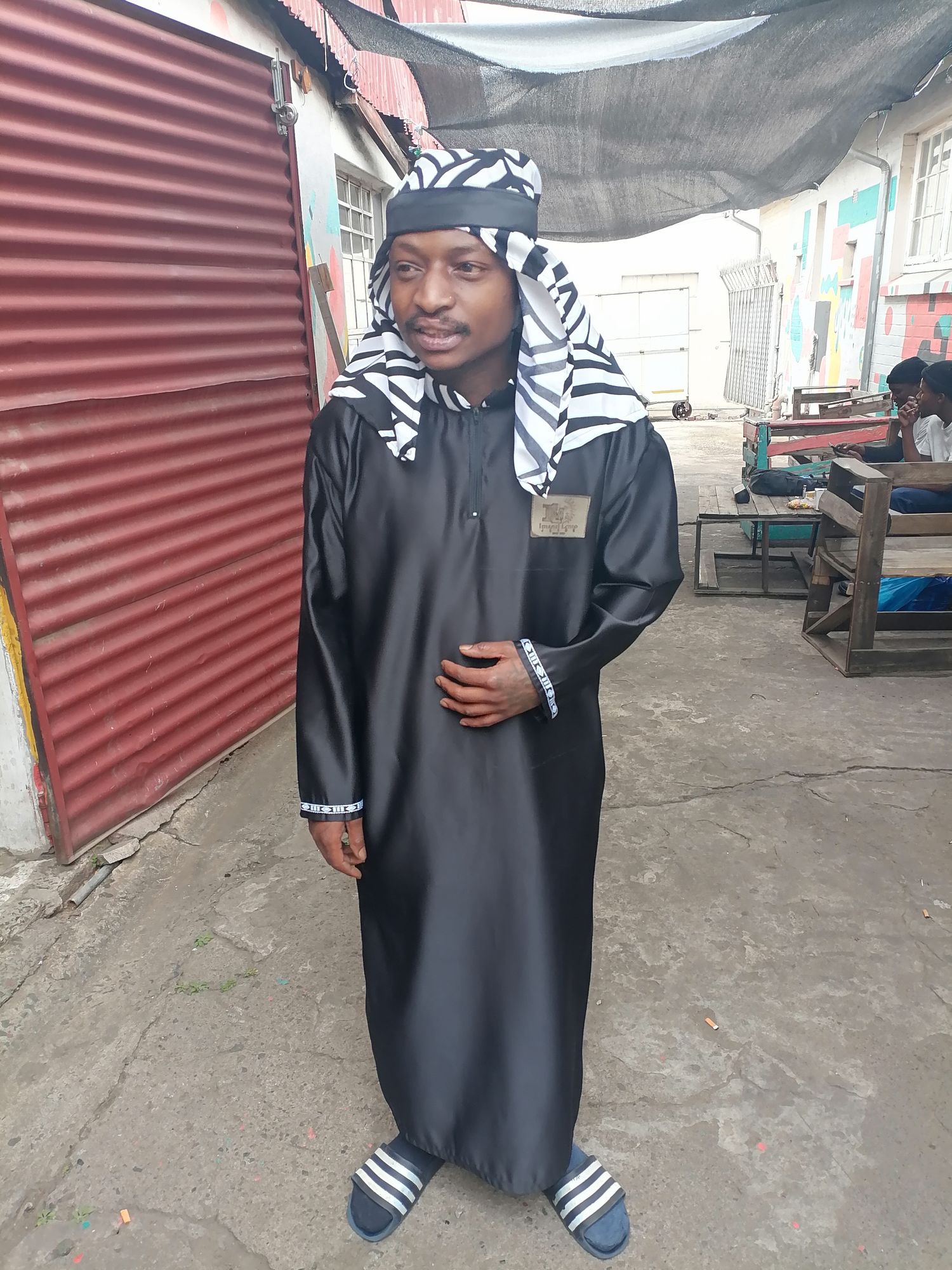 May you please put the person in the image in front of a mosque in an Arab desert

May you put gold around him like an Arabian prince