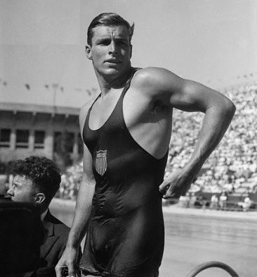 ripped and torn no sleeves shirt very hand some and muscular, short blonde hair Buster Crabbe Buck Rogers