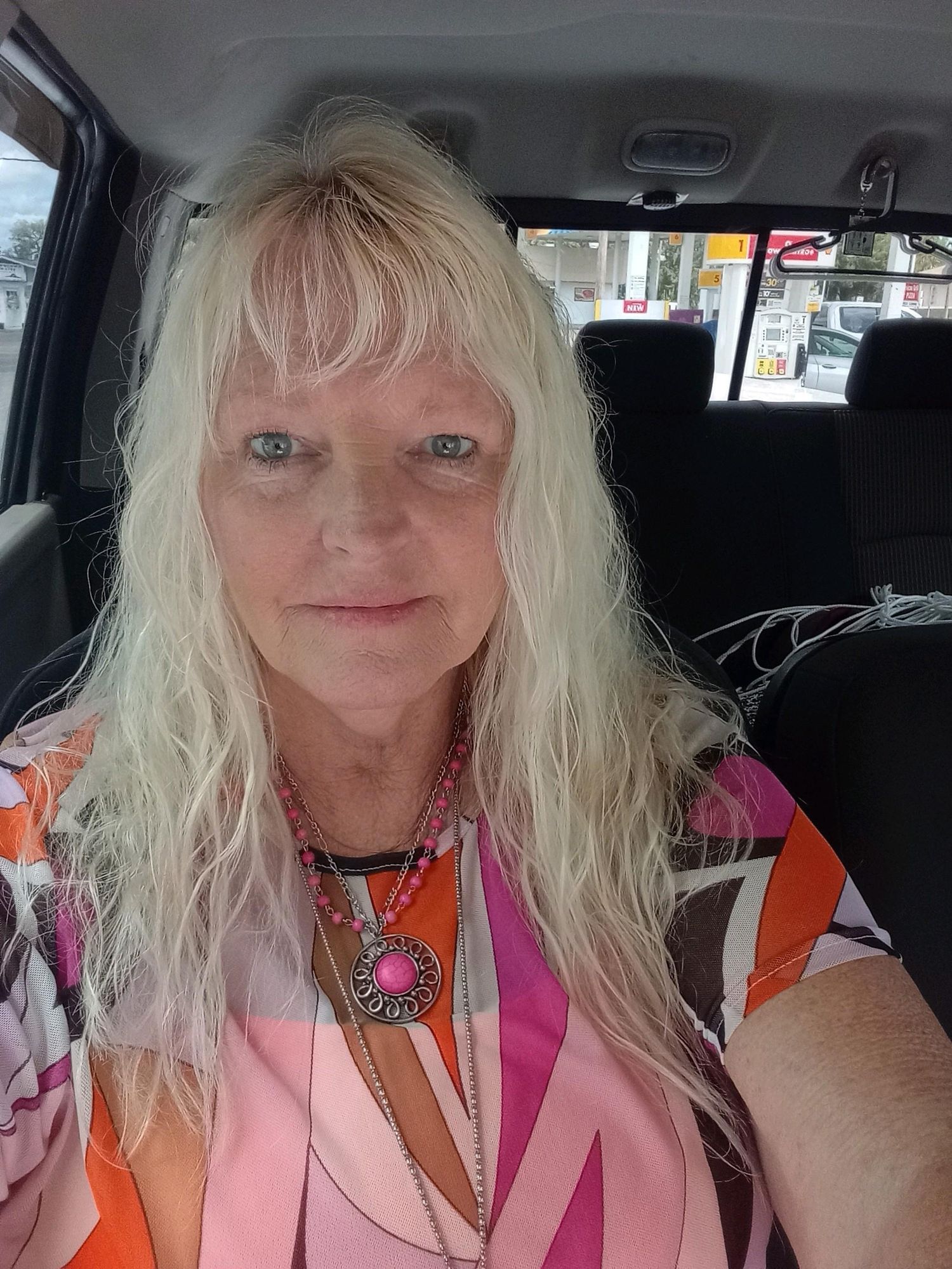 A mesmerizing close-up portrait of a gorgeous beautiful stunning blonde woman enveloped in a aqua haze, capturing intricate details of delic...