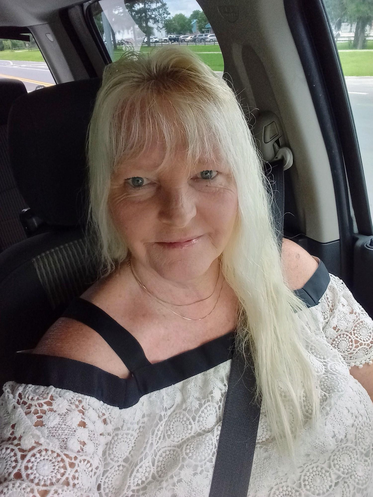 A mesmerizing close-up portrait of a gorgeous beautiful stunning blonde woman enveloped in a aqua haze, capturing intricate details of delic...