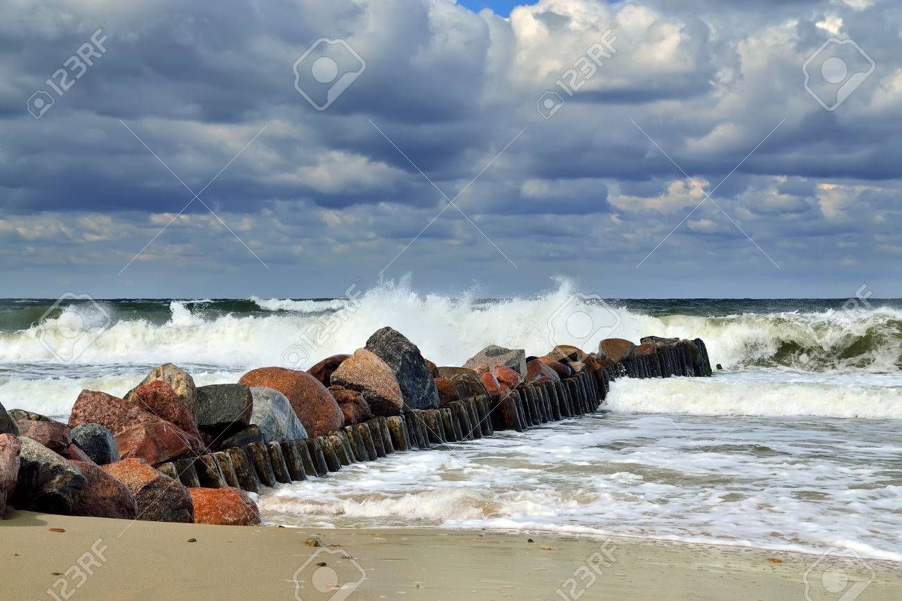 It was time to scatter stones, and it was time to gather stones. An old seaman is sadly looking to a woman. Man  white beard, wear polo. Fem...