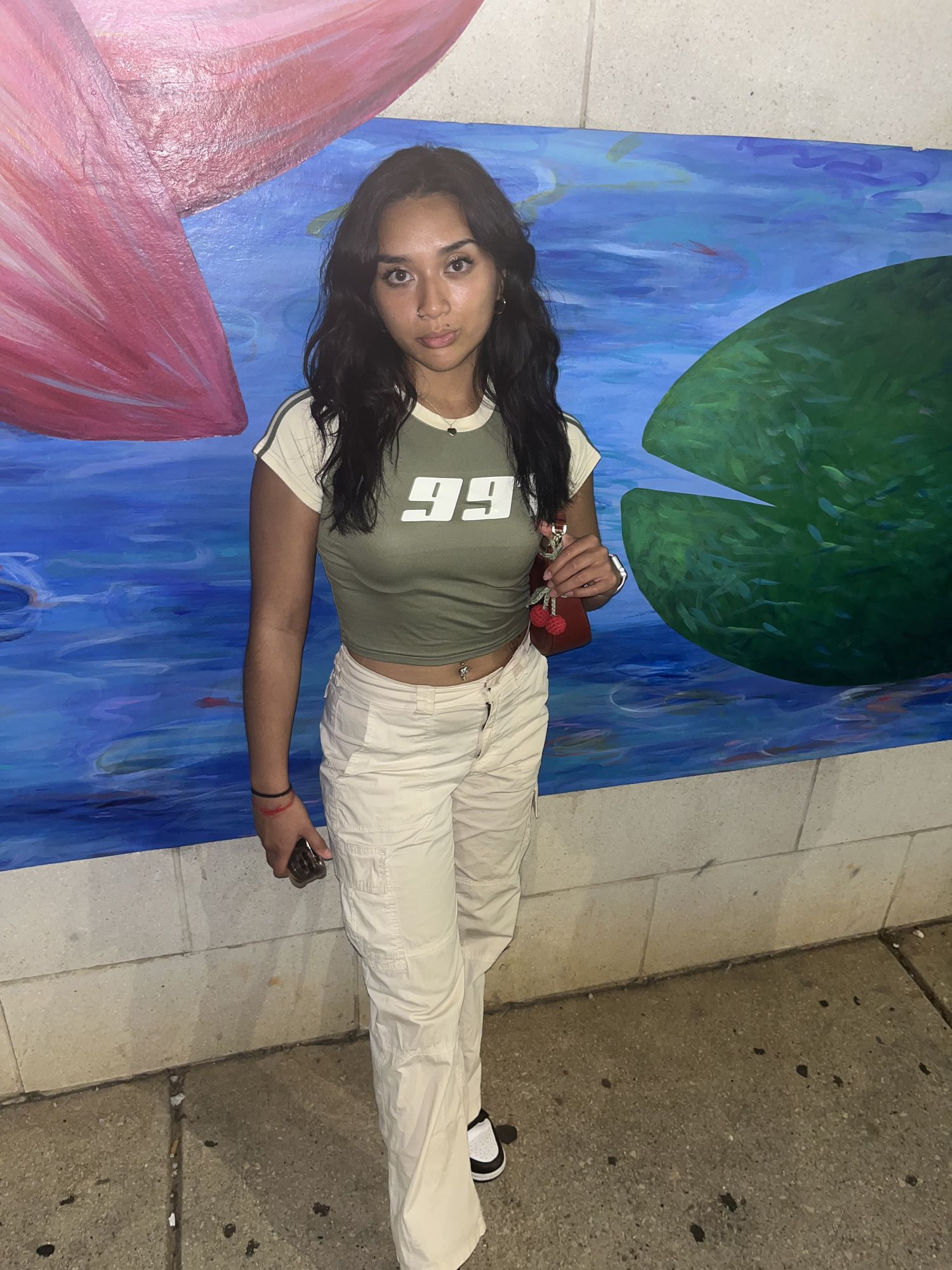 <lora:Tofu:1.0>80s anime style. medium  distance voluminous long wavy dark hair framing face and along back. dark Skin. Full Lips. Long Eyel...