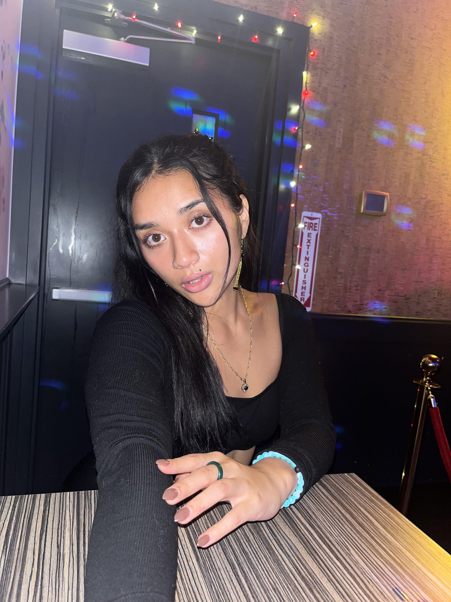 <lora:Tofu:1.0> 80s anime style. voluminous long wavy dark hair framing face and along back. Tan Skin. Full Lips. Long Eyelashes. Hoop Earri...