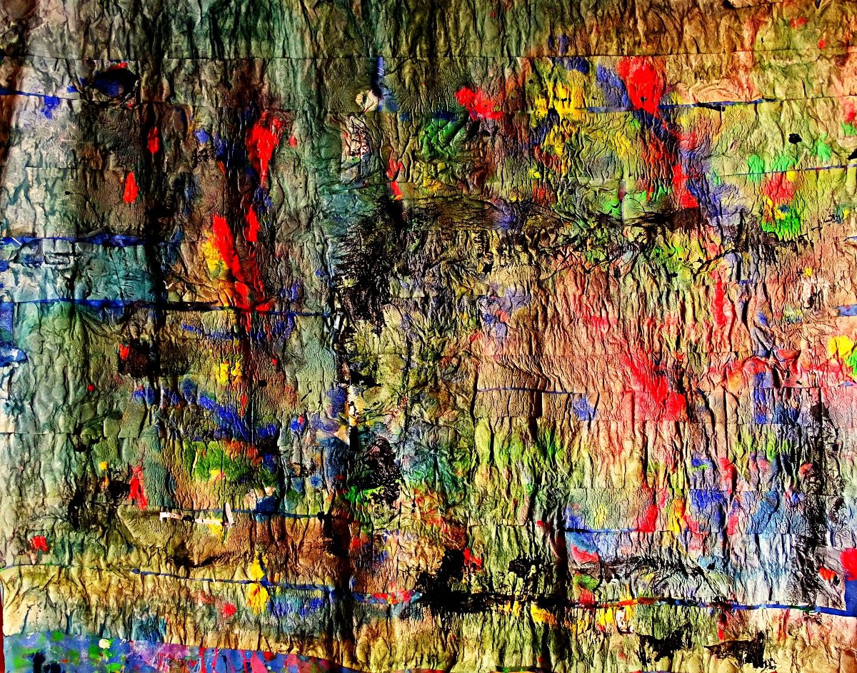 Bright and vibrant colors are splashed across a textured surface, creating an abstract composition. Various hues and shades interplay, formi...