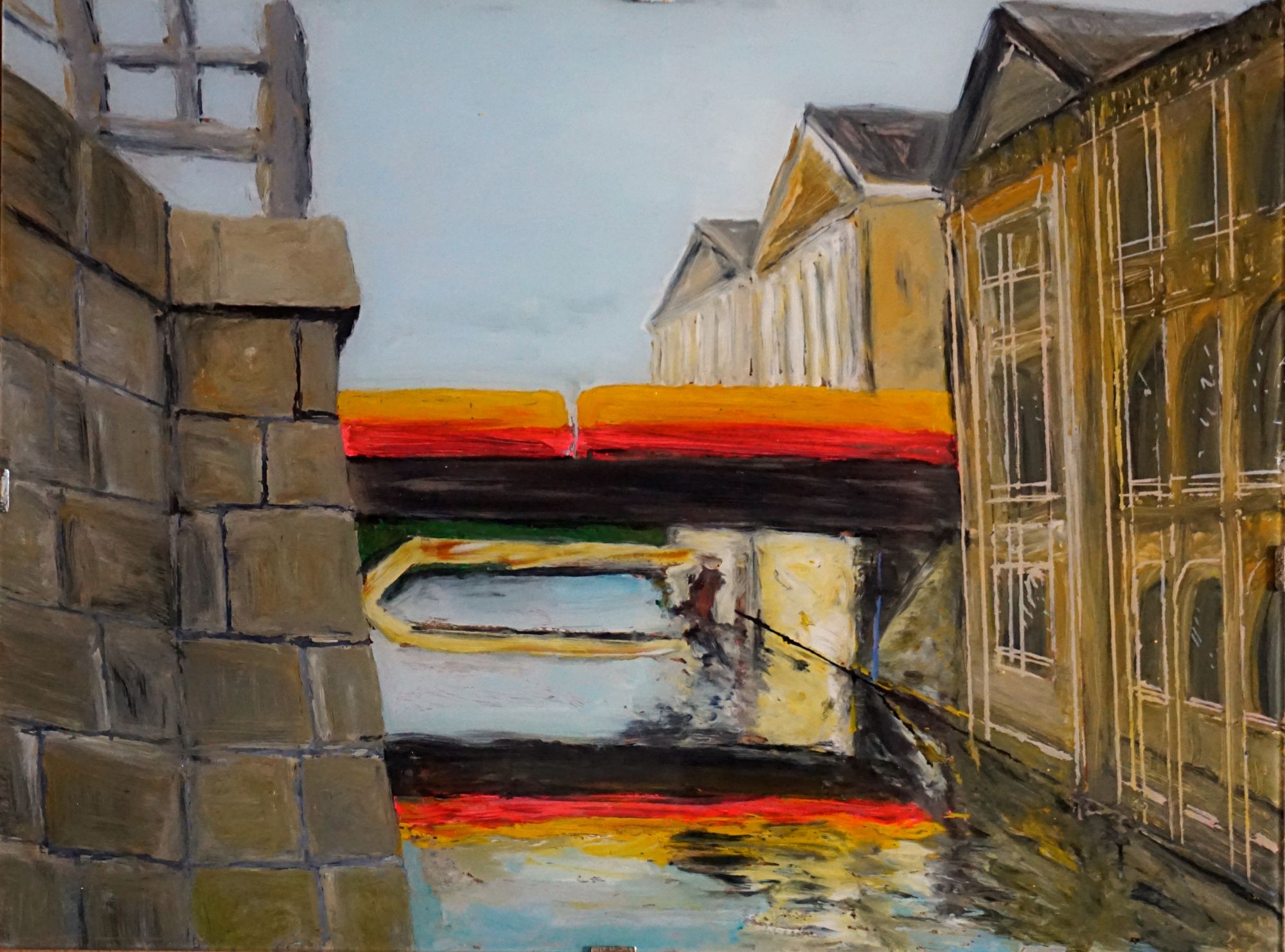 A cityscape features a canal with reflections in the water and a bold, colorful bridge in the background. The architectural structures on ei...