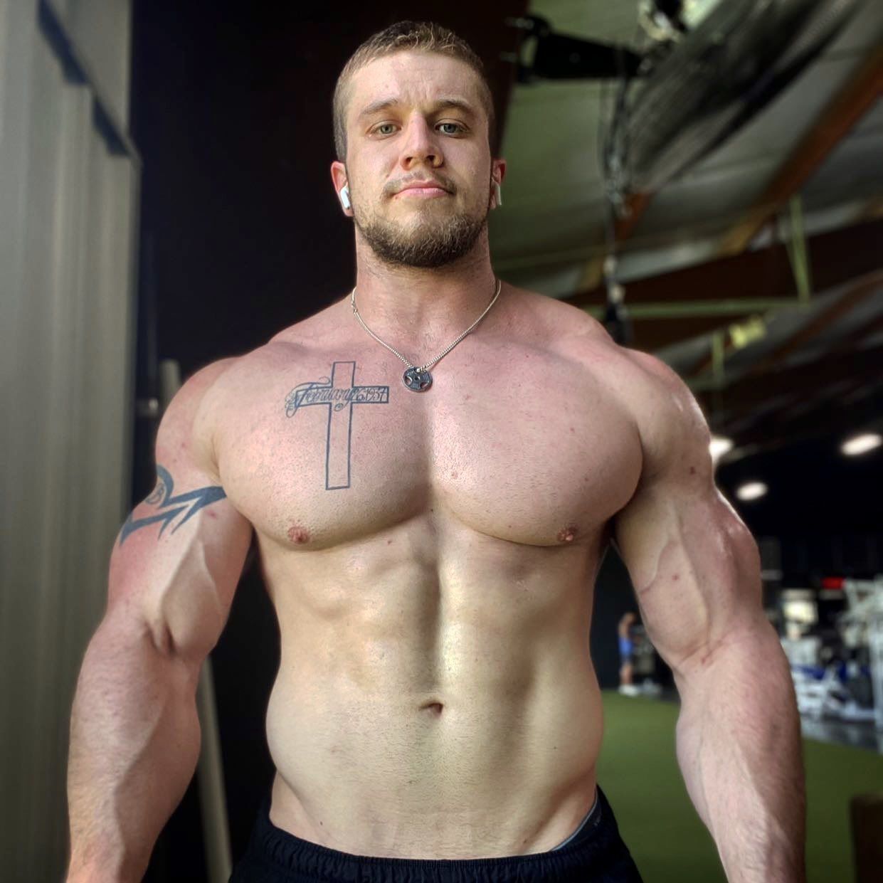 Mature gym goer bulging muscles 