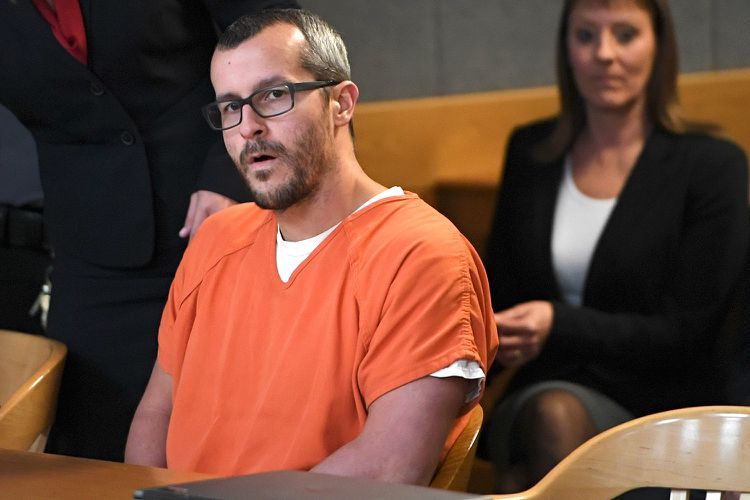 Chris Watts (sitting in a court room:1) while two (angels of baby girls:1.5) glides next to him.